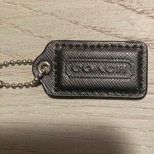 Black leather Coach bag tag